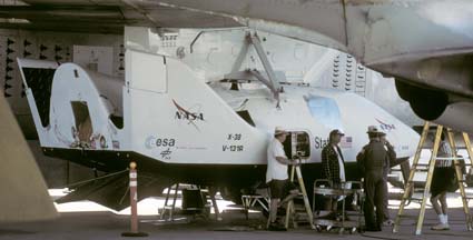 X-38 V-131R under the wing of Boeing NB-52B Stratofortress, 52-0008 on the flightline at Edwards AFB