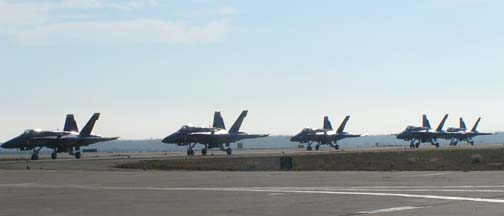 McDonnell-Douglas F/A-18 Hornets of the Blue Angels taxi to show center.
