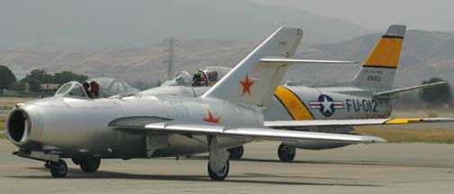 MiG-15, NX87CN and North American F-86F Sabre, N186AM