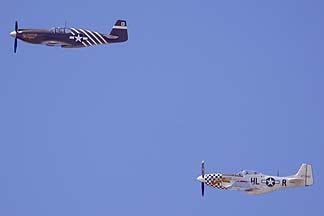 North American P-51A-10NA Mustang NX4235Y Mrs Virginia and P-51D Mustang N251BP Buzzin Cuzzin