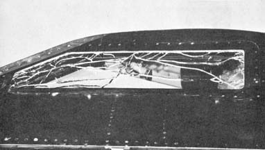 Broken left outer windshield panel on October 11, 1961
