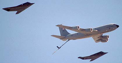 F-117 FSD Nighthawks fly formation on a KC-135R Stratotanker