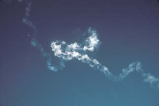 Delta-II exhaust trail is contorted by winds aloft on December 7, 2001